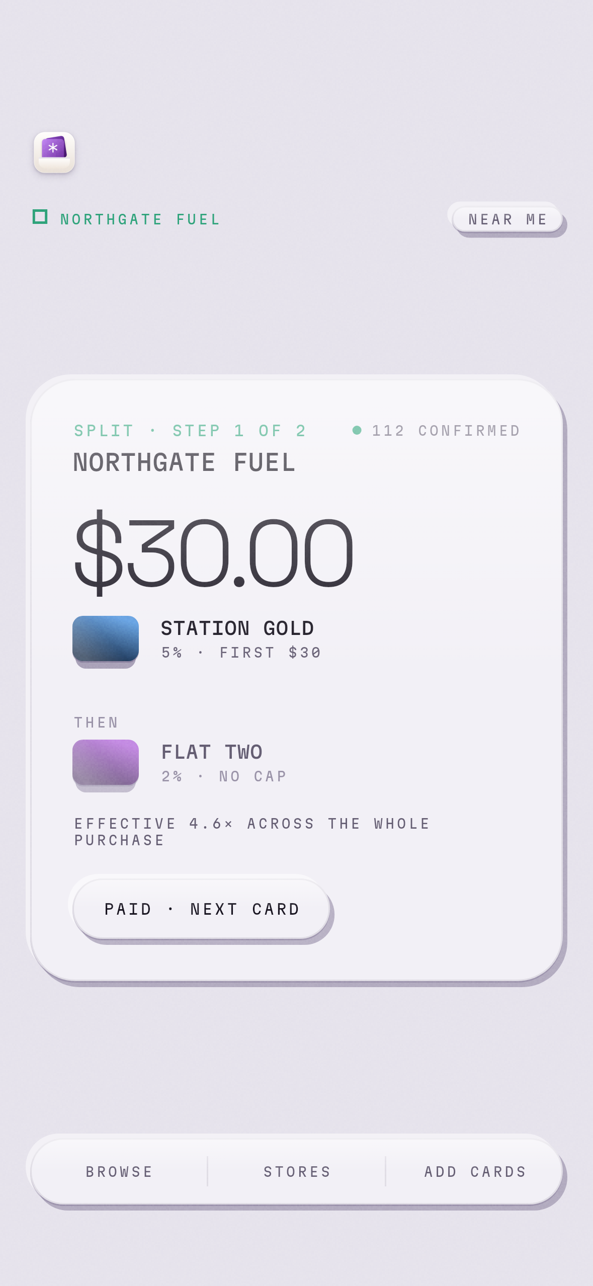 The app showing step one of a two-card split at a fuel station: an amount to put on the first card, with the second waiting underneath.